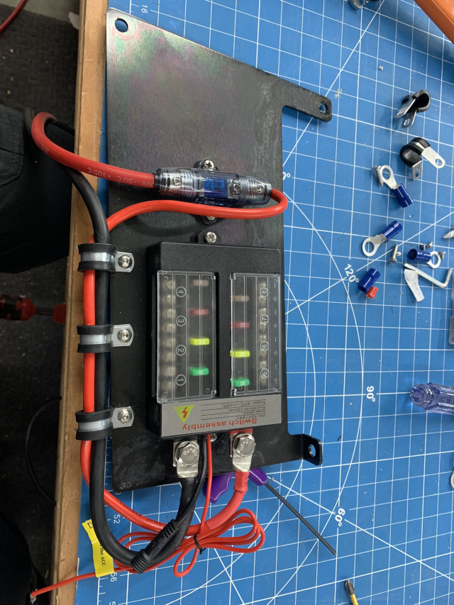 Drilling the plate and wiring the switch on the bench.